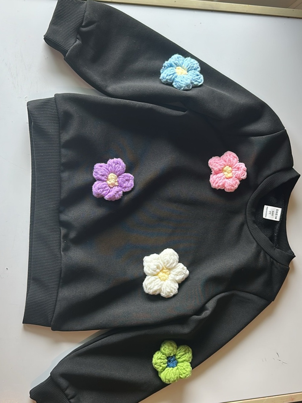 SHEIN Black Sweater with Blue Pink Purple White and Green Crochet Flowers